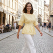FJØRNA women's summer linen blouse, flowy casual top worn by a woman outdoors, showcasing lightweight, breezy fabric.