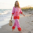 FJØRNA relaxed two-piece set featuring nautical and geometric graphic motifs, worn in a casual lifestyle setting.