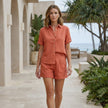 FJØRNA Coastal Ease button-up shirt and relaxed shorts set, featuring a breezy, casual style perfect for summer.