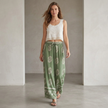 Women’s summer wide-leg cotton trousers by FJØRNA, styled casually with a relaxed fit and lightweight fabric for warm weather.