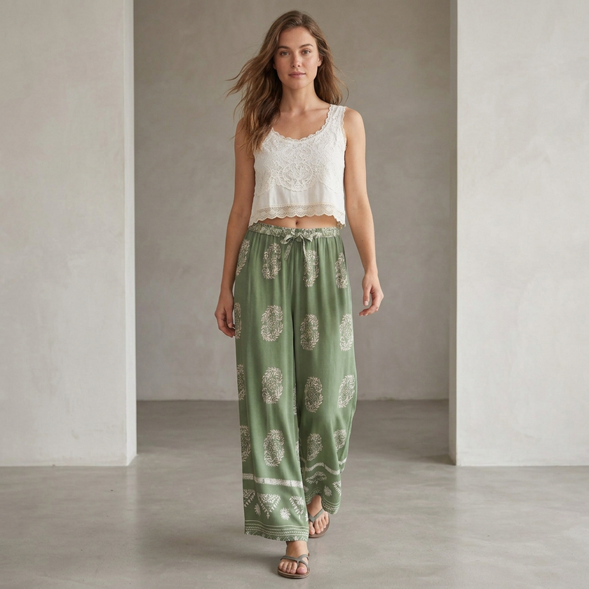 Women’s summer wide-leg cotton trousers by FJØRNA, styled casually with a relaxed fit and lightweight fabric for warm weather.