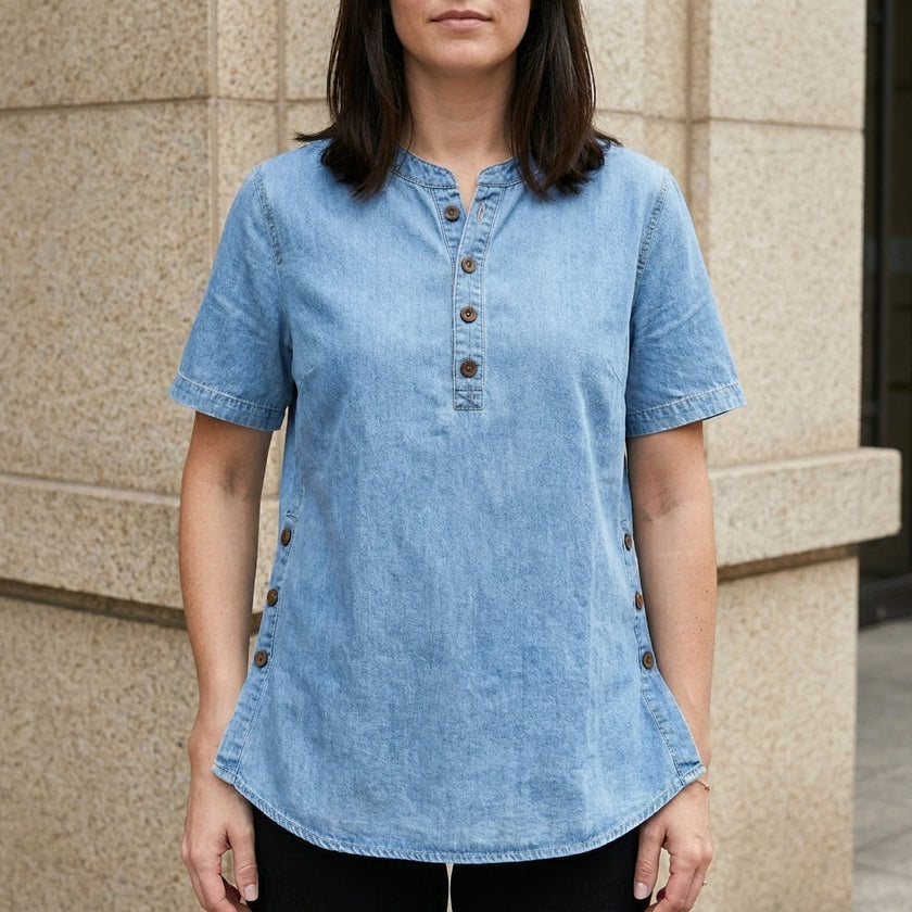 Light blue FJØRNA women's summer denim top with button front, sleeveless design, and casual fit.