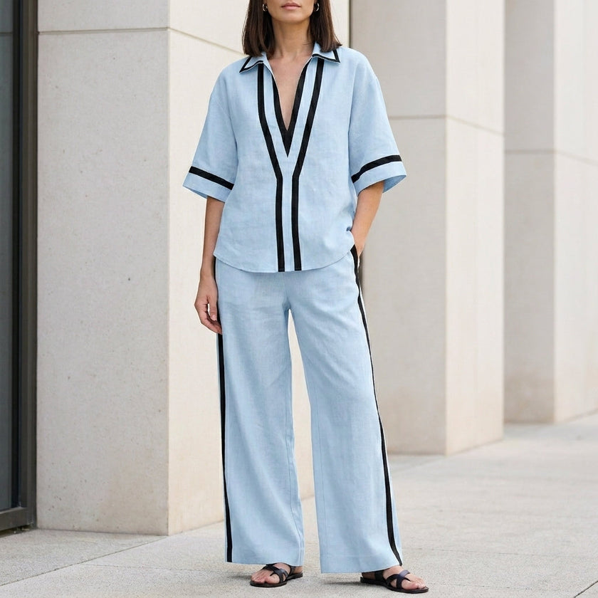 Light blue coastal chic contrast trim top and wide-leg pants set by FJØRNA, stylish 2-piece ensemble perfect for warm weather.