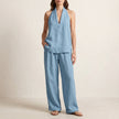 Light blue FJØRNA relaxed two-piece halter V-neck set with wide-leg pants, casual and stylish summer outfit.