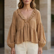 Light brown women's summer blouse by FJØRNA featuring a V-neck, long sleeves, and ruffle denim design.