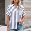 Light gray FJØRNA summer blouse for women with striped linen fabric, button front, casual style, and relaxed fit.