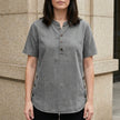 Light gray FJØRNA women's summer top with denim fabric and button front, stylish and comfortable for warm weather.
