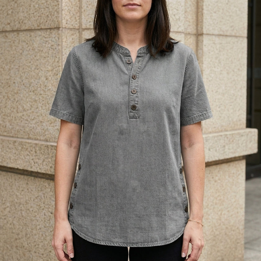 Light gray FJØRNA women's summer top with denim fabric and button front, stylish and comfortable for warm weather.
