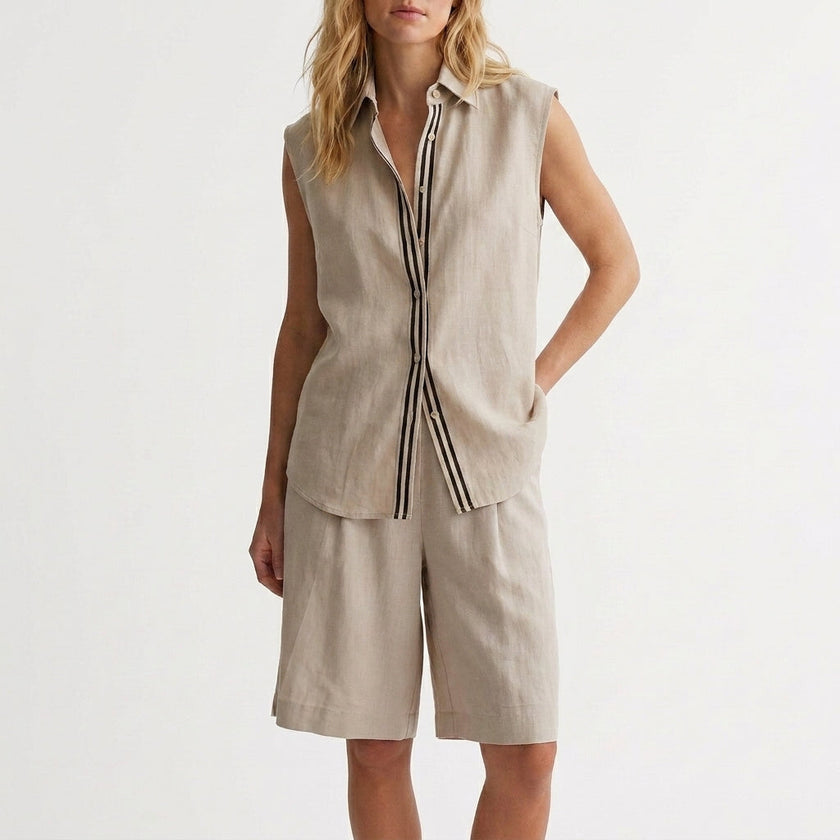Light gray relaxed sleeveless button-up shirt and wide-leg pleated shorts set by FJØRNA, casual summer 2-piece outfit.