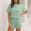 Light green ribbed knit relaxed two-piece set from FJØRNA featuring a drop shoulder top and matching mini shorts.