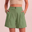 Light green women's summer shorts by FJØRNA featuring high waist, linen fabric, breathable design, and front pockets.