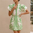 Light green FJØRNA 2-piece set with puff sleeve button-front top and A-line mini skirt, featuring a band collar.