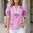 Light purple floral summer blouse for women with V-neck, puff sleeves, and high waist, by FJØRNA.