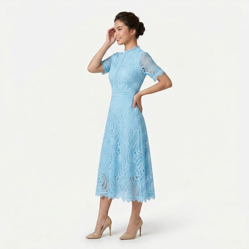 Light blue FJØRNA women's lace midi dress with high neck and cutwork detail, shown from a 3/4 side front view.