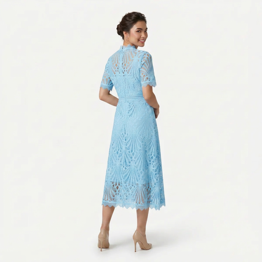 Back view of FJØRNA women's light blue lace midi dress featuring a high neck, elegant silhouette, and refined cutwork detail.