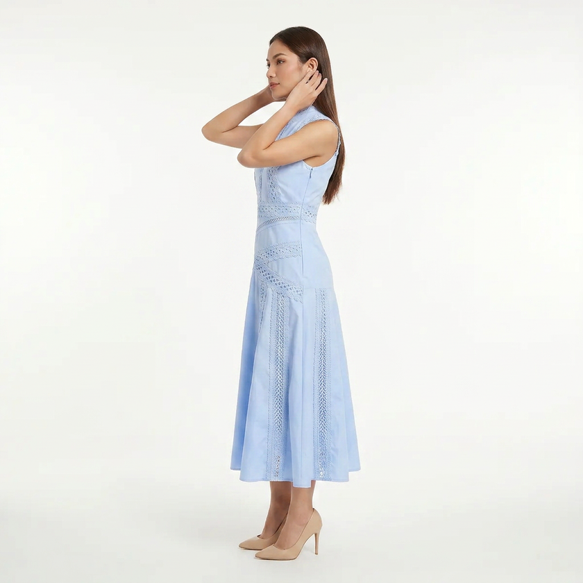Light blue FJØRNA women's sleeveless lace panel midi dress shown in side profile with a 3/4 pose.