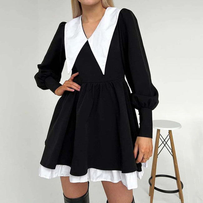 FJØRNA Like a Doll black collar dress featuring a fitted silhouette, ideal for streetwear and Y2K fashion styles.