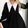 Black collar dress by FJØRNA, like a doll style, featuring a sleek black design and modern streetwear-inspired fashion.