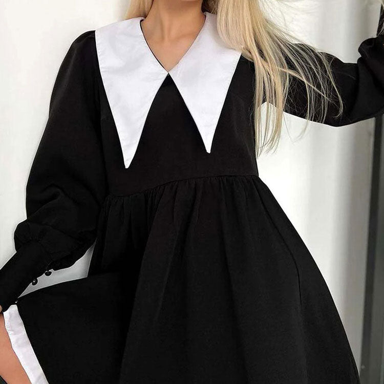 Black collar dress by FJØRNA, like a doll style, featuring a sleek black design and modern streetwear-inspired fashion.
