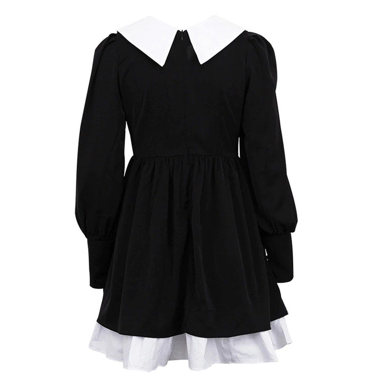 FJØRNA Like a Doll black collar dress, stylish black tie dress with a modern Y2K streetwear vibe, showcased on a model.