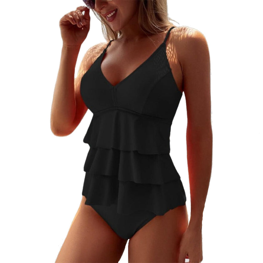 Women's summer V-neck swimsuit with ruffles by FJØRNA, featuring a flattering fit and stylish design for beach or pool.