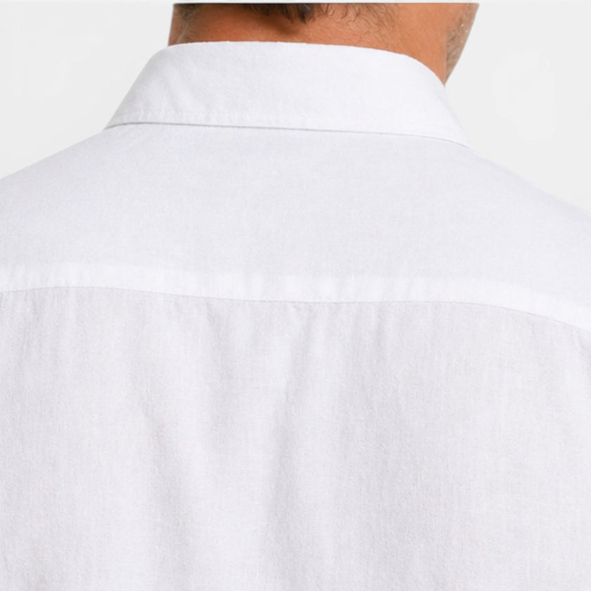 Men's linen shirt by FJØRNA with short sleeves, breathable fabric, and a classic fit, ideal for warm weather.
