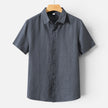 Men's FJØRNA linen shirt with short sleeves, breathable fabric, and classic fit, ideal for comfortable summer wear.
