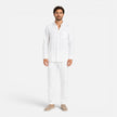 FJØRNA men's summer linen set with breathable, lightweight two-piece design featuring collar and button details.