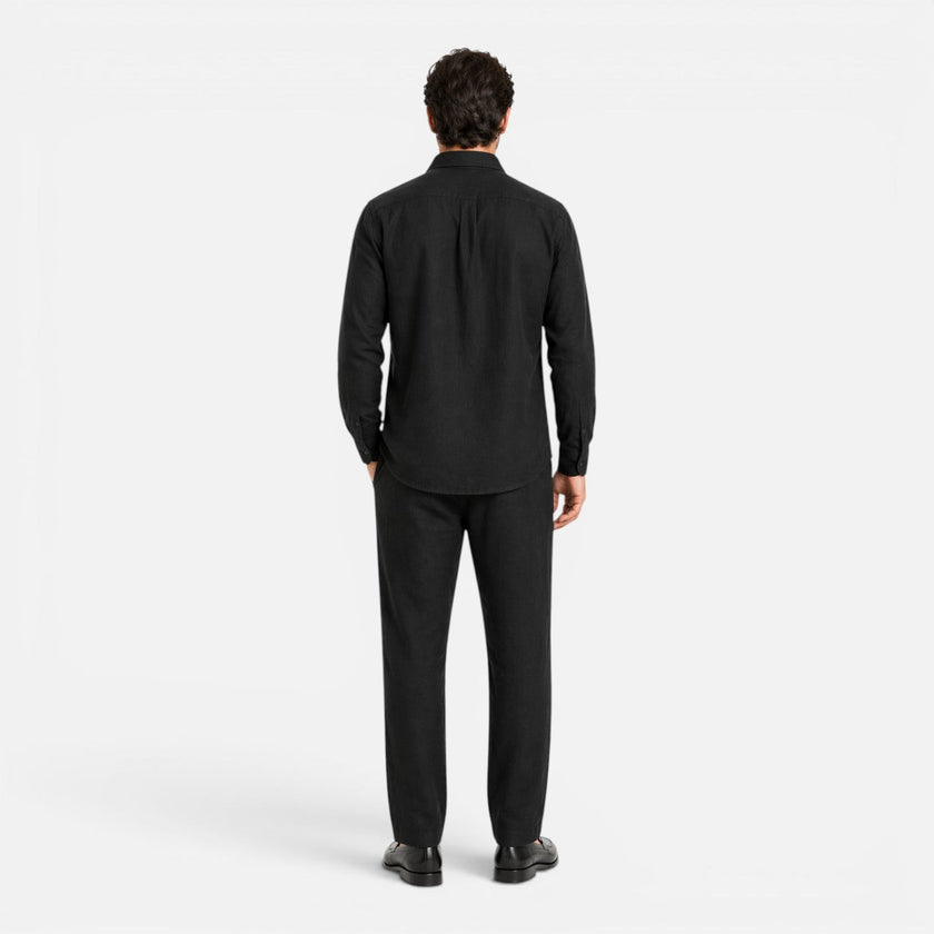 Men's lightweight linen summer outfit by FJØRNA, breathable two-piece set with collar and button details for summer wear.