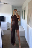 FJØRNA women's asymmetric draped mini dress with one-shoulder design, high neckline, fitted sleeveless style, ruched details.