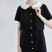 FJØRNA Little Witch Mini Black Dress, stylish Y2K-inspired black dress with fitted silhouette and modern streetwear vibe.
