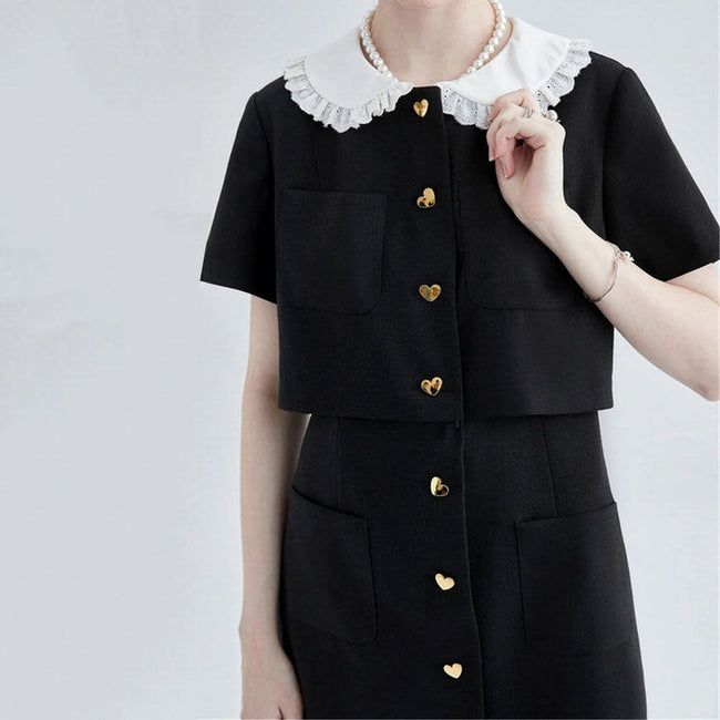 FJØRNA Little Witch Mini Black Dress, stylish Y2K-inspired black dress with fitted silhouette and modern streetwear vibe.