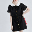 FJØRNA Little Witch Mini Black Dress, stylish black mini dress with a trendy Y2K streetwear design, shown on a model.