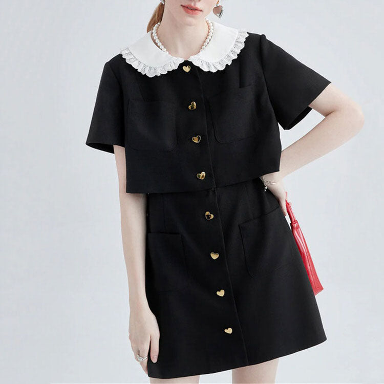 FJØRNA Little Witch Mini Black Dress, stylish black mini dress with a trendy Y2K streetwear design, shown on a model.
