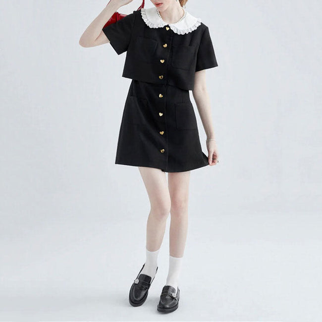 FJØRNA Little Witch Mini Black Dress featuring a sleek, fitted design, perfect for stylish streetwear and Y2K fashion looks.