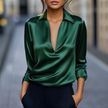 Emerald green satin V-neck long sleeve summer blouse for women, stylish FJØRNA top with wide-leg design in London setting