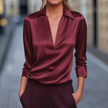 Red satin summer blouse for women with V-neck and long sleeves, featuring a stylish wide-leg design by FJØRNA.