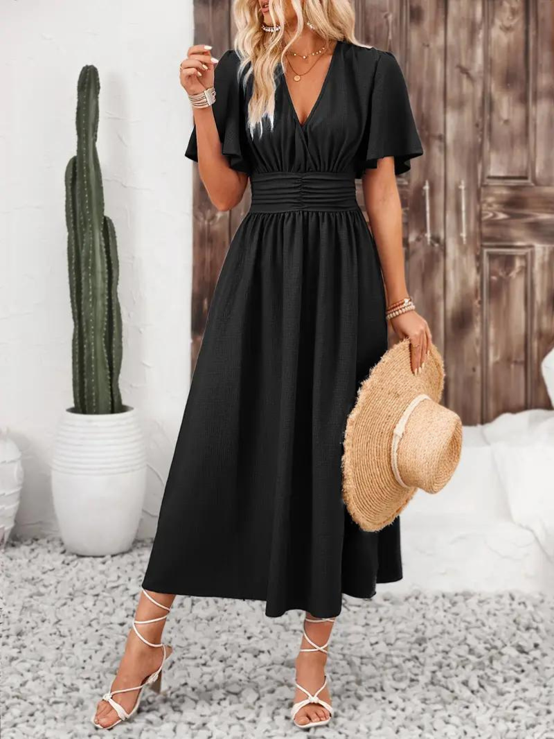 FJØRNA Arielle white long dress with short sleeves and V-neck, a stylish maxi sundress perfect for summer wear.
