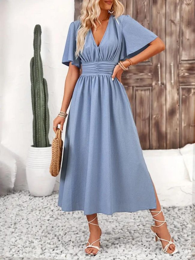 FJØRNA Arielle white long dress with short sleeves, V-neck design, maxi sundress perfect for summer fashion.
