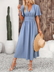 FJØRNA Arielle white long sundress with short sleeves and V-neck, featuring a flowing maxi design perfect for summer.