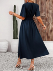 FJØRNA Arielle white maxi sundress with short sleeves and V-neck, flowing fabric perfect for summer casual wear.