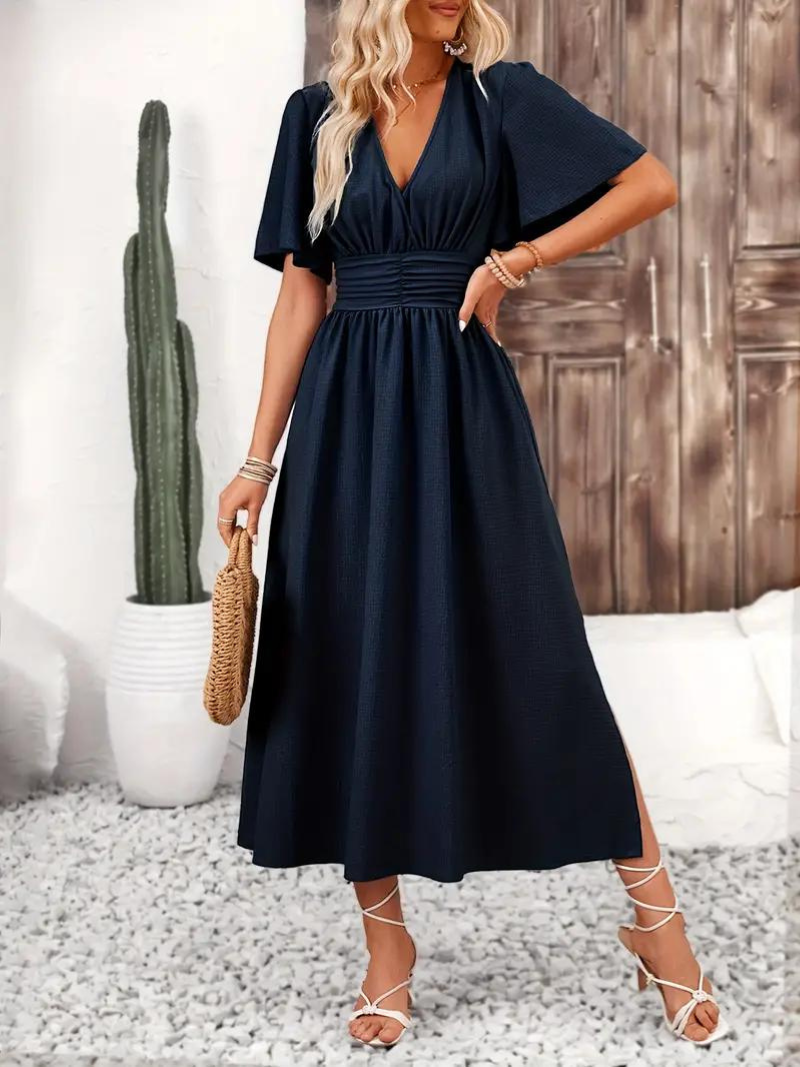 FJØRNA Arielle white long dress with short sleeves, V-neck, maxi length, perfect for summer sundress fashion.