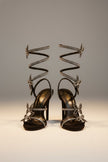 FJØRNA women's stiletto sandals with butterfly wrap design, rhinestones, and heeled style, featuring elegant, open-toe footwear.