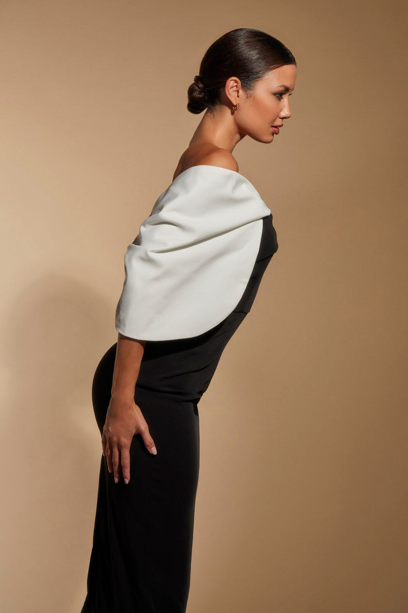 FJØRNA Ava off-shoulder midi dress in white with sculpted monochrome detail, stylish and elegant for special occasions.
