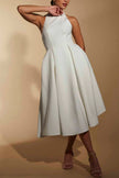 FJØRNA ivory line midi dress with halter neckline, flowing fabric, and elegant design, perfect for summer or special occasions.