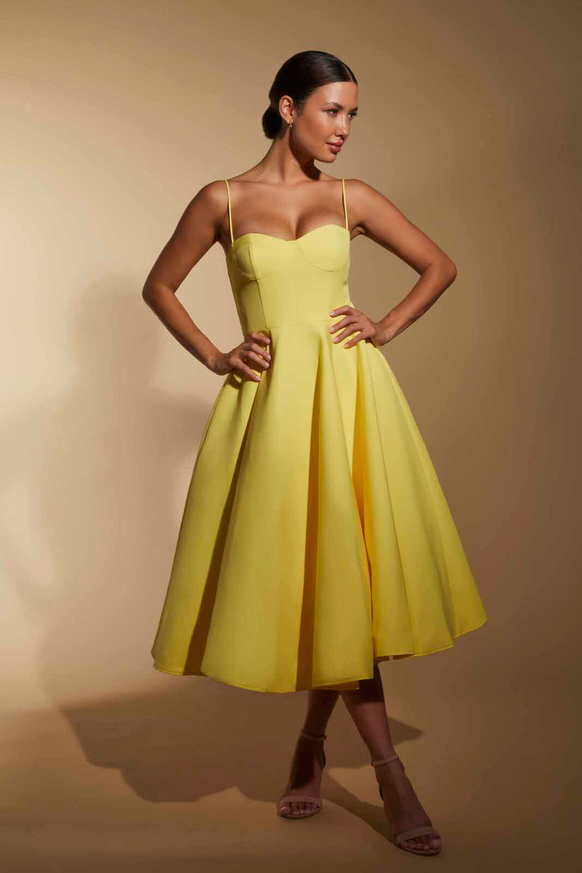 FJØRNA Jones Skater Midi Dress with cami straps in white, featuring a fitted bodice and flowing skirt, perfect for casual wear