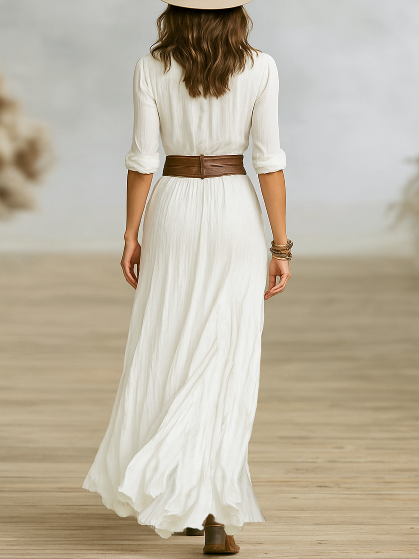 FJØRNA elegant women's maxi dress with V-neck and belt, flowing fabric and waist tie, perfect for formal or casual occasions.