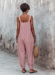 FJØRNA striped sleeveless women's jumpsuit with square neck, loose-fit, wide-leg pants, and vertical stripe pattern.