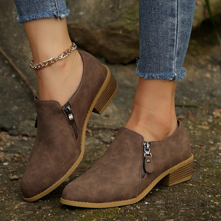 FJØRNA Bronte orthopedic zip-up ankle boots in black leather with sturdy soles and side zipper for easy wear.