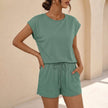 Malachite green summer two-piece women's co-ord set by FJØRNA with pockets, featuring a stylish, comfortable matching top and pants.